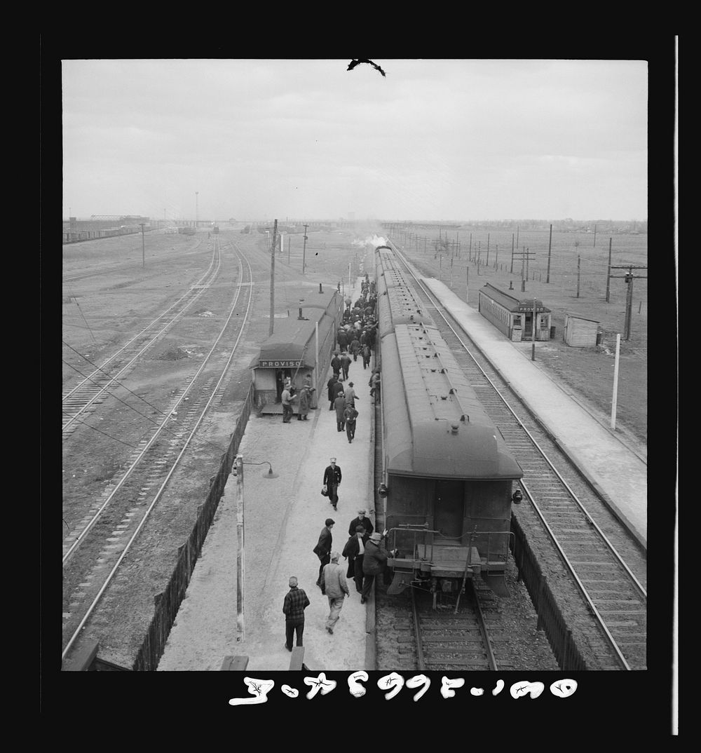 Chicago, Illinois. Workmen at the Proviso yard of the Chicago and Northwestern Railroad taking the suburban train for home.…