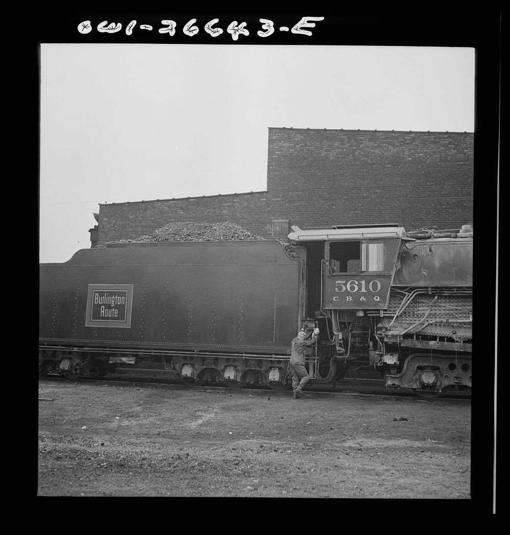 Cicero, Illinois. Engineer climbing into the cab of his engine at the roundhouse at the Clyde yard of the Chicago…