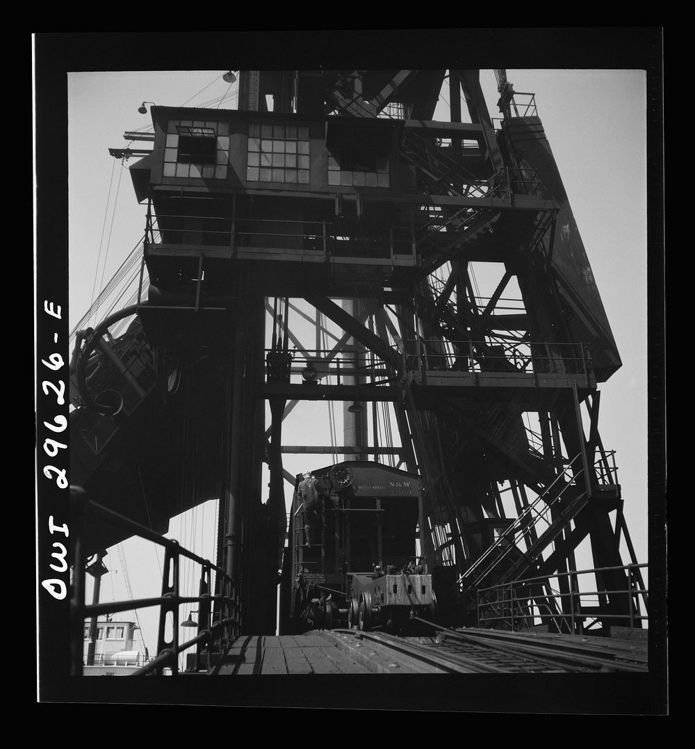 [Untitled photo, possibly related to: Sandusky, Ohio. A carload of coal at the loading machine at the Pennsylvania Railroad…