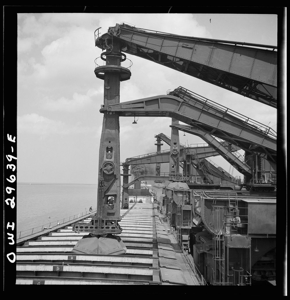 Cleveland, Ohio. Unloading iron ore from a lake freighter by means of Hewlett [i.e., Hulett] unloaders at the Pennsylvania…