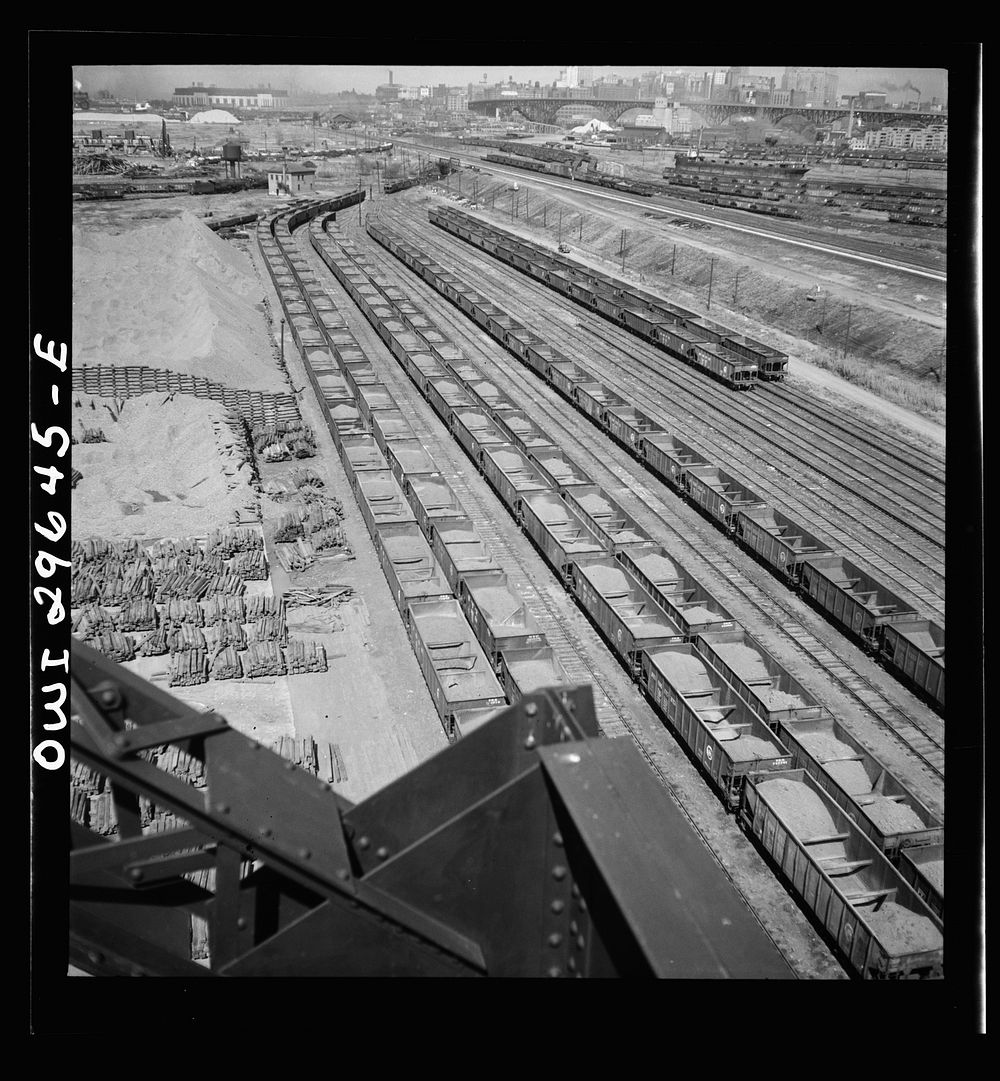 Cleveland, Ohio. On the right, empty cars waiting to be loaded at the Pennsylvania Railroad docks; on the left, loaded cars…
