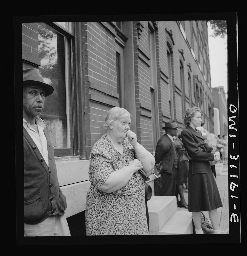 Baltimore, Maryland. Funeral of a merchant seaman. Mourning neighbors and friends. Sourced from the Library of Congress.