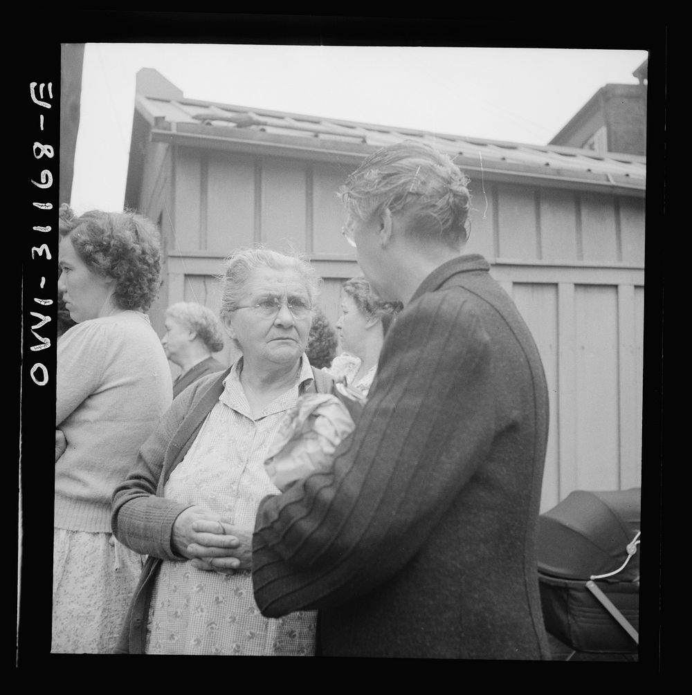 Baltimore, Maryland. Funeral of a merchant seaman. Mourning neighbors and friends. Sourced from the Library of Congress.