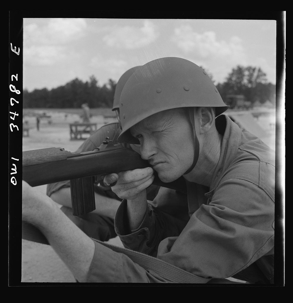 Warner Robins, Georgia. Air Service Command, Robins Field. Private Walter F. Guthrie learning marksmanship with a carbine.…