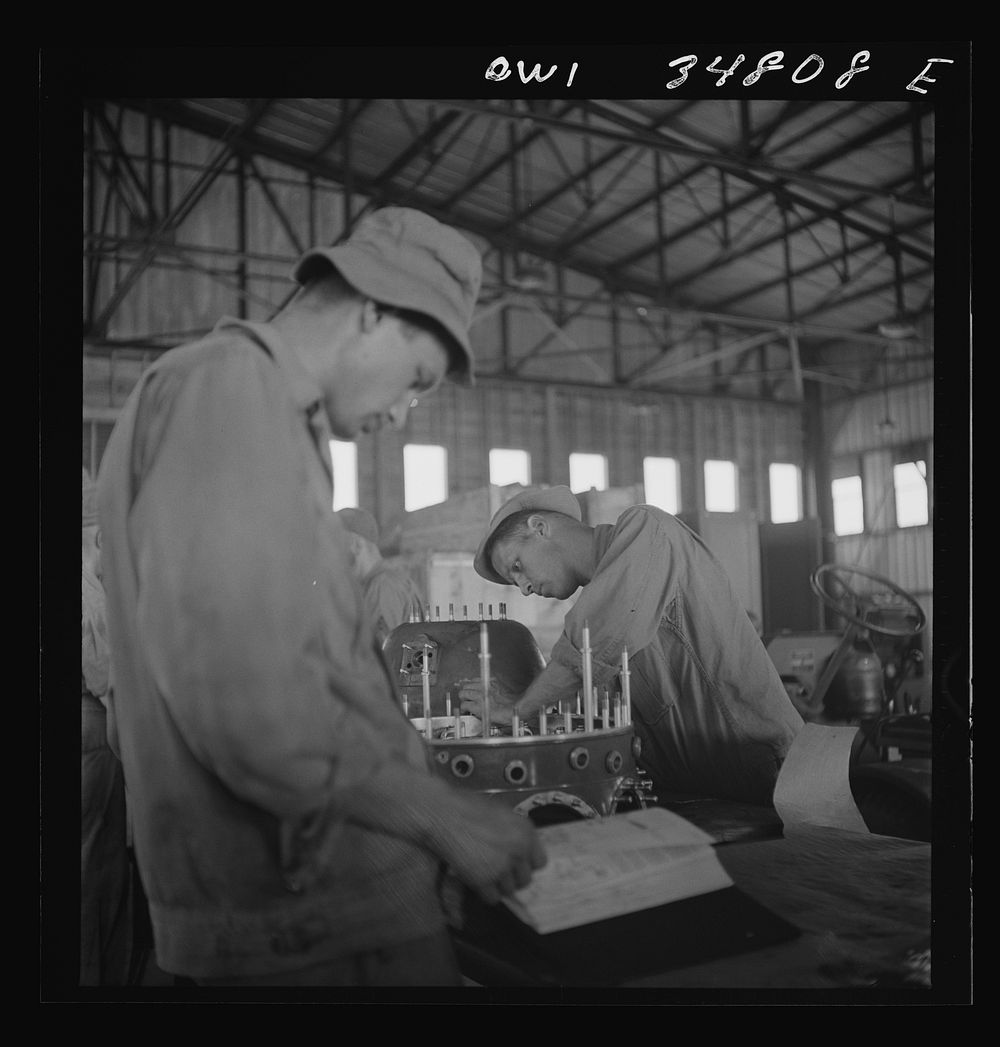 [Untitled photo, possibly related to: Warner Robins, Georgia. Air Service Command, Robins Field. Assembling the nose of a…