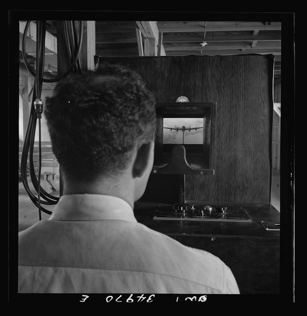 [Untitled photo, possibly related to: Daniel Field, Georgia. Air Service Command. Learning to identify aircraft in a machine…