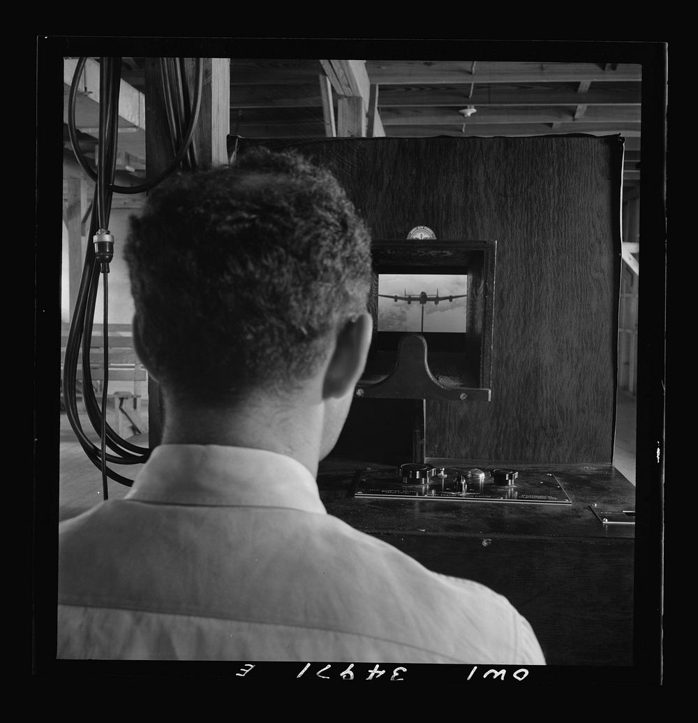 Daniel Field, Georgia. Air Service Command. Learning to identify aircraft in a machine which shows models in various…