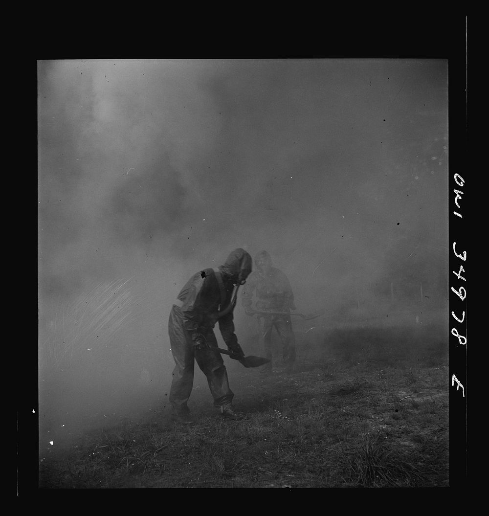 [Untitled photo, possibly related to: Daniel Field, Georgia. Air Service Command. Men of a chemical unit demonstrating the…