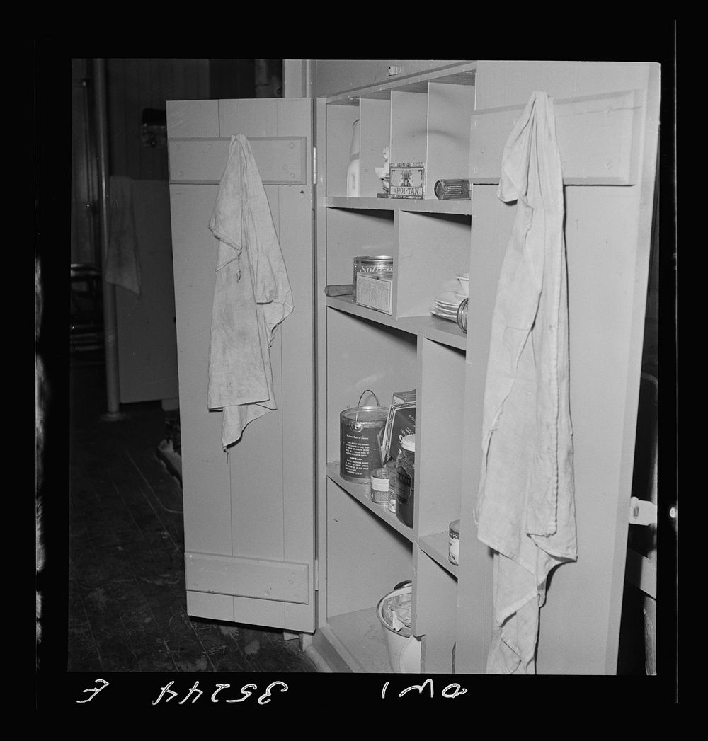 Clovis, New Mexico. Food cupboard in a new Atchison, Topeka and Santa Fe Railroad caboose. Sourced from the Library of…