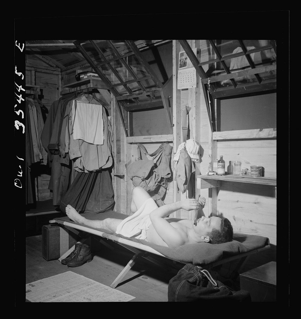 Greenville, South Carolina. Air Service Command. A scene in one of the barracks. Enlisted man playing a flute after he has…