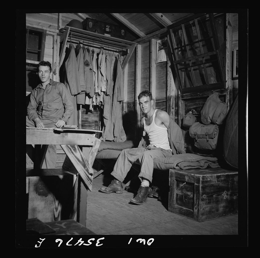 [Untitled photo, possibly related to: Greenville, South Carolina. Air Service Command. Enlisted man folding up his gas mask…