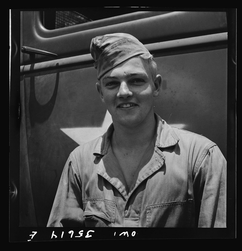 Myrtle Beach, South Carolina. Air Service Command. Private Herbert Lippe, airplane mechanic with the mobile unit. His home…