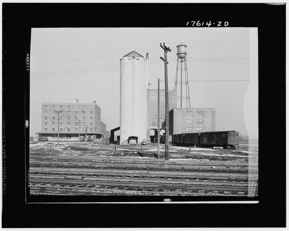 Chicago, Illinois. Warehouses and elevator near the freight yards of the Indiana Harbor Belt line railroad. Sourced from the…