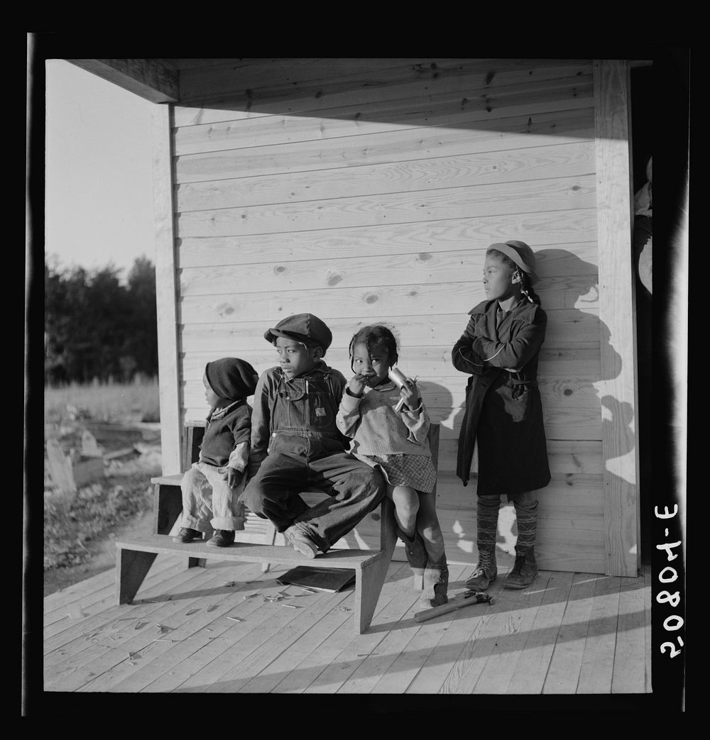 [Untitled photo, possibly related to: Children of rehabilitation client on front porch of new home near Raleigh, North…