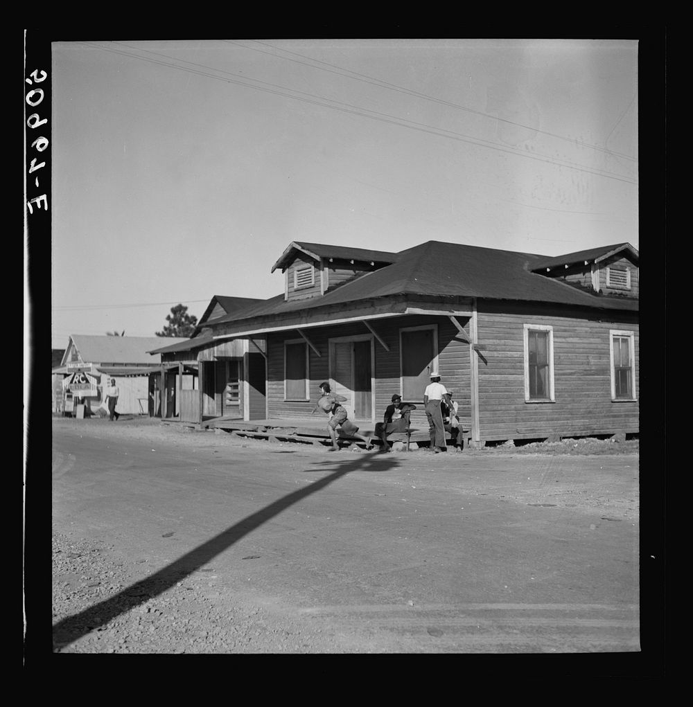 [Untitled photo, possibly related to: Main street, showing barber shop in  section. Homestead, Florida]. Sourced from the…