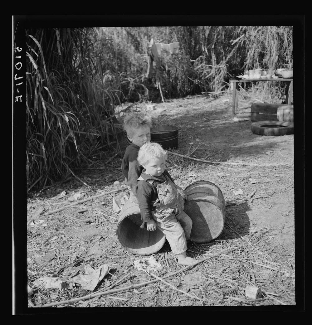 [Untitled photo, possibly related to: Child of packinghouse workers from Tennessee, his face covered with  muck which causes…