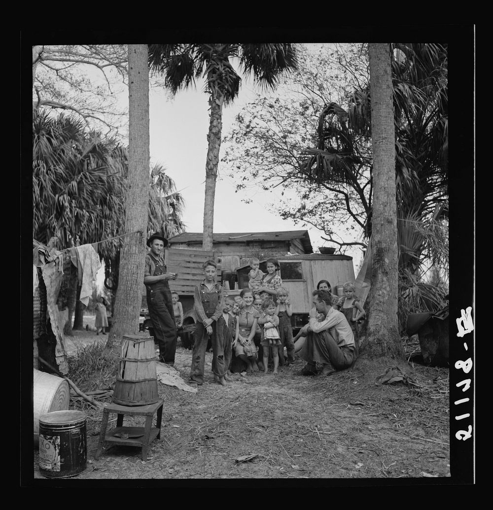 Migrant laborers' camp near Canal Point, Florida. In foreground is a bean hamper which they use to sit on and they call a…