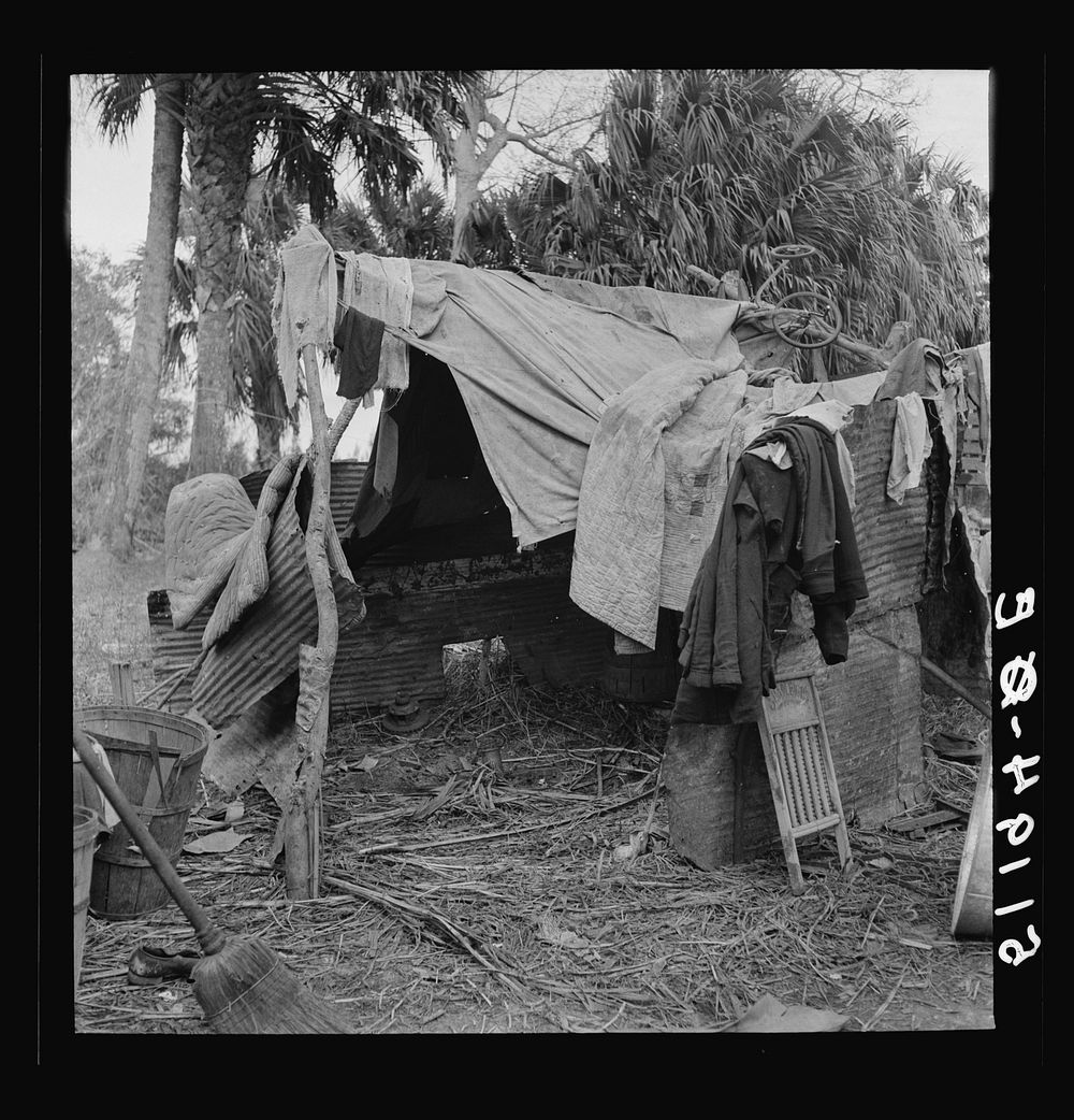 Part of migrant laborers' camp (packinghouse workers) near Canal Point, Florida. Just enough land to set up camp rents for…