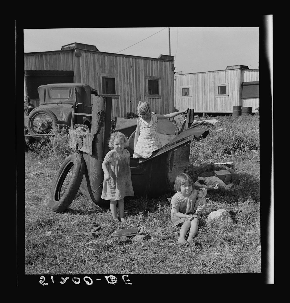 Migrant laborers children living in overcrowded camps with very bad sanitary conditions. Belle Glade, Florida. Sourced from…