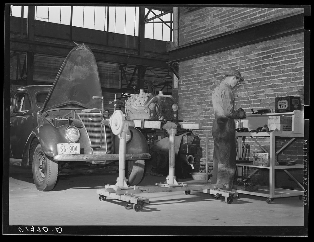 Repairing automobile motor at FSA (Farm Security Administration) warehouse depot. Atlanta, Georgia. Sourced from the Library…
