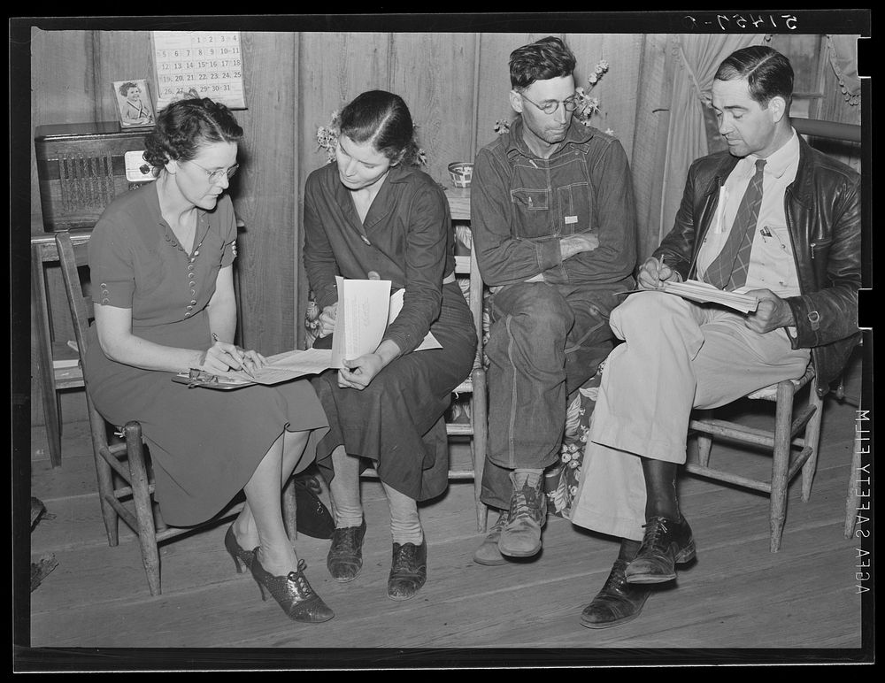 Mr. Ellis and Miss Christian making farm and home plans with Mr. & Mrs. E.H. Wise, RR  (Rural Rehabilitation) family. There…