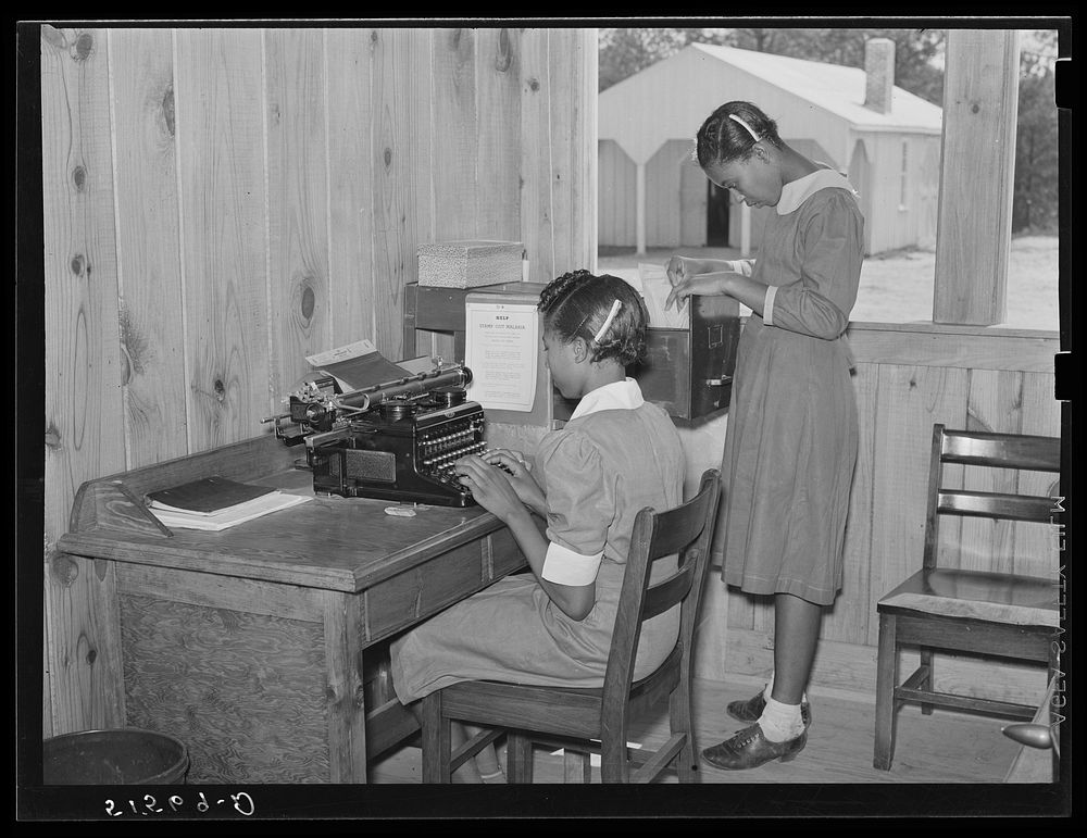 Students learn office and secretarial work by helping principal Robert Pierce. Gee's Bend, Alabama. Sourced from the Library…