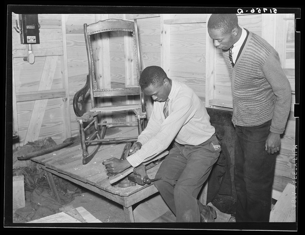 Mending a chair in shop class. Prairie Farms, Alabama. Sourced from the Library of Congress.