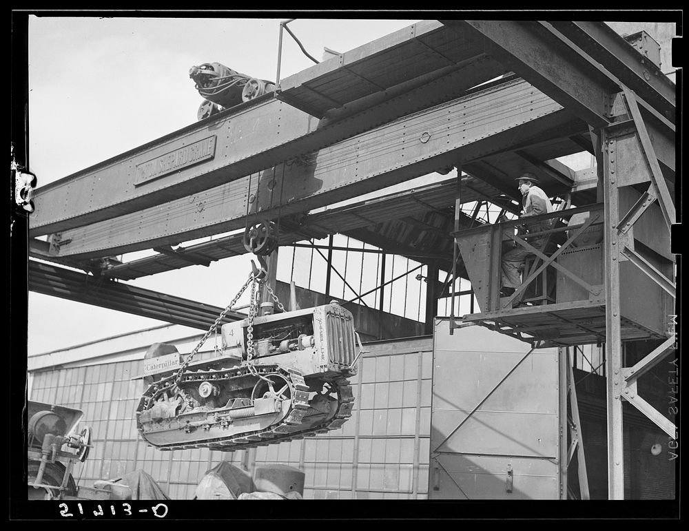 [Untitled photo, possibly related to: Tractor, transported by truck to FSA (Farm Security Administration) warehouse depot…