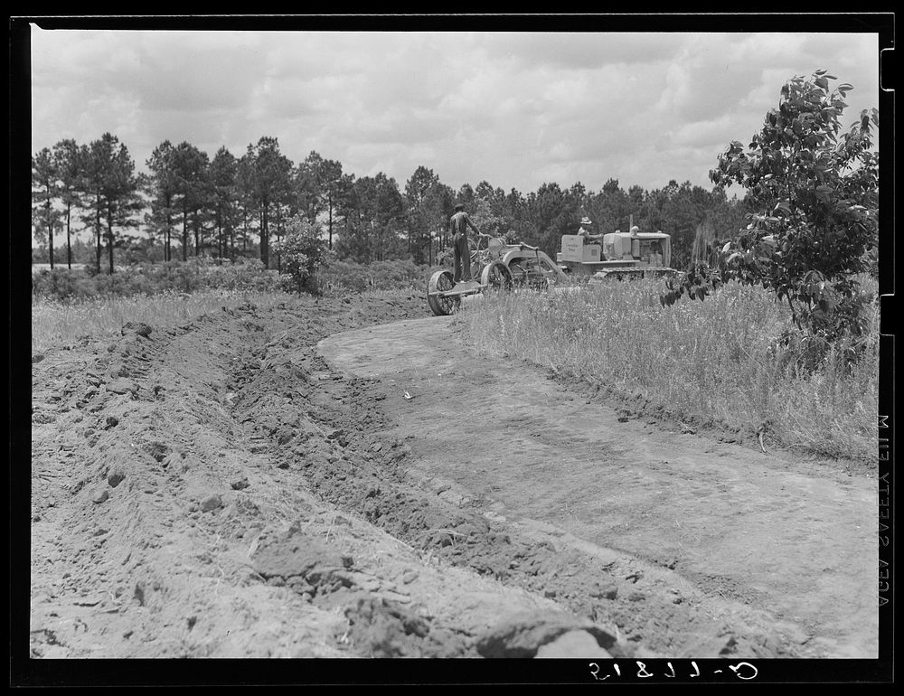 FSA (Farm Security Administration) supervisors watching terracing of client's land. Greene County, Georgia. Sourced from the…