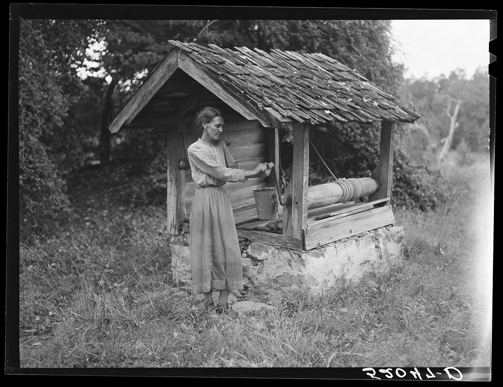 Miss Nettie Lloyd, pellagra victim, by their old well house. Orange County, North Carolina. Sourced from the Library of…