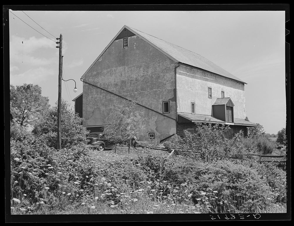 [Untitled photo, possibly related to: Barn on rich farmland. Bucks County, Pennsylvania]. Sourced from the Library of…