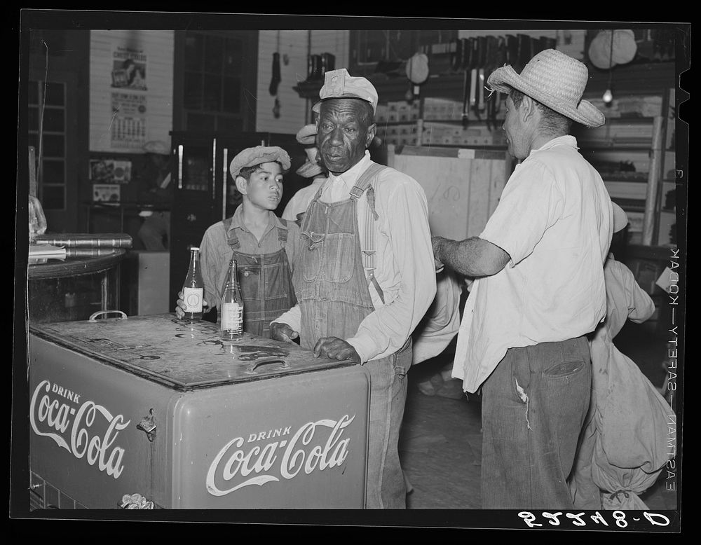 Mexican and  cotton pickers inside plantation store, Knowlton Plantation, Perthshire, Mississippi Delta. This transient…