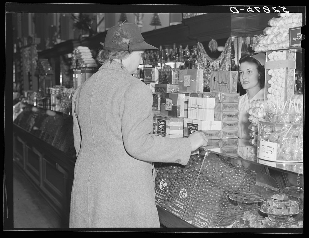 [Untitled photo, possibly related to: Mrs. Elvin Wilkins (Rosa) buying candy to send away to her daughter at school. She…