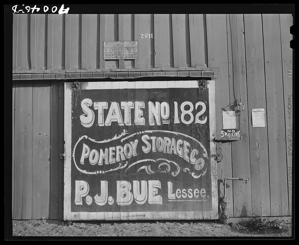 Sign on sack warehouse used for storing wheat. Garfield County, Washington by Russell Lee