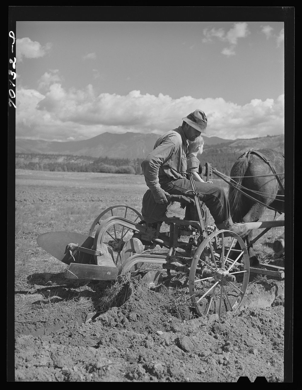 FSA (Farm Security Administration) rehabilitation borrower plowing. Boundary County, Idaho by Russell Lee