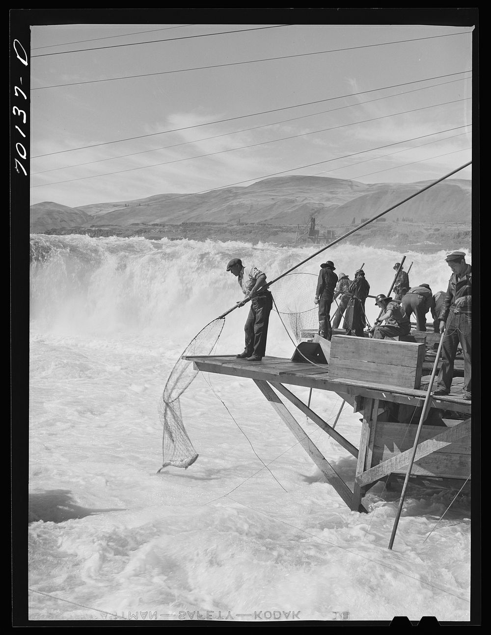 [Untitled photo, possibly related to: Indians fishing for salmon at Celilo Falls, Oregon. At the present time Indians have…