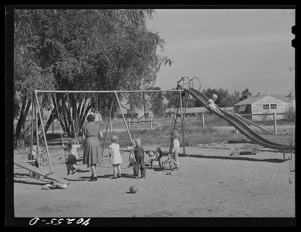 Children playing at the nursery school at the FSA (Farm Security Administration) farm family migratory labor camp. Yakima…