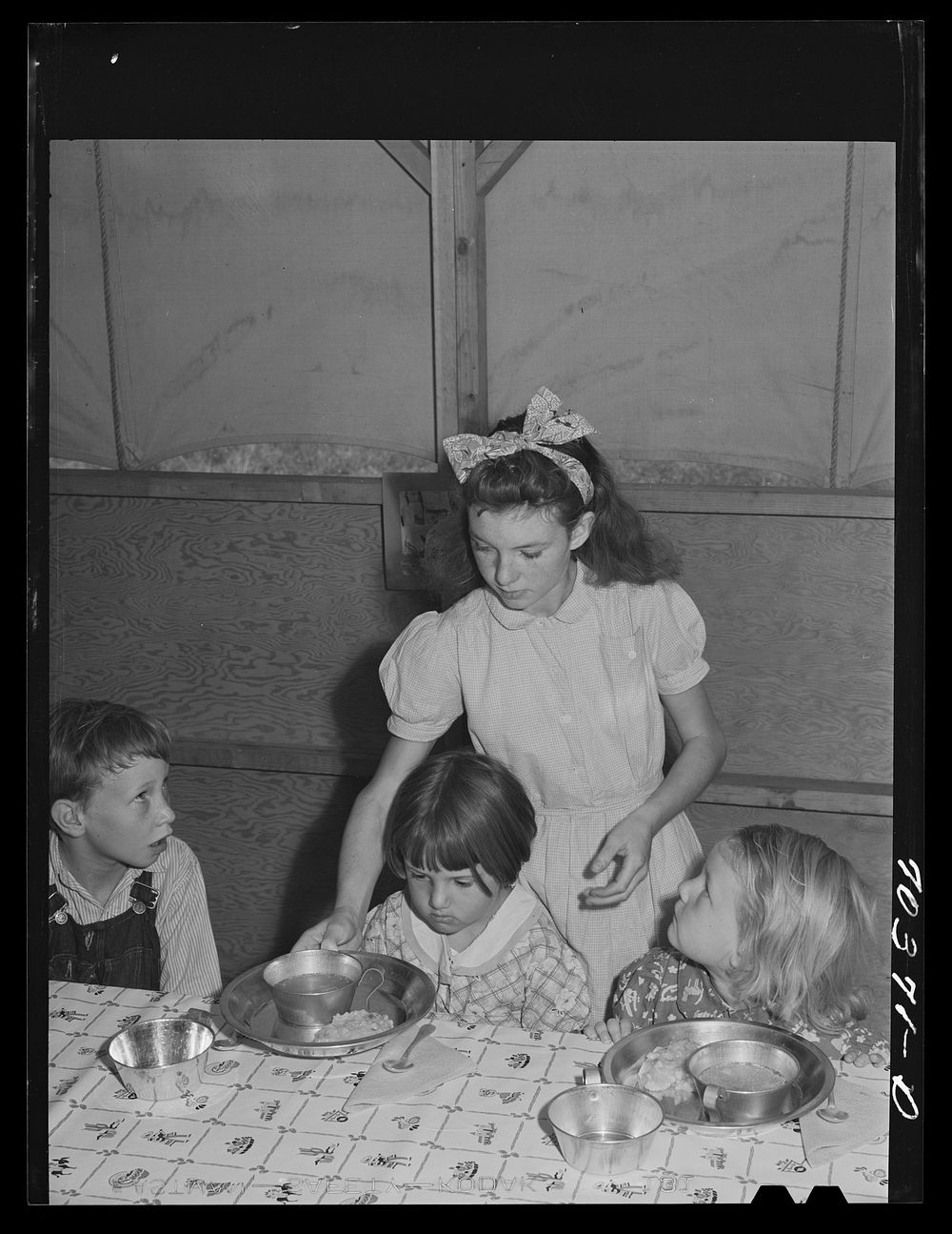 Lunchtime at the nursery school at the FSA (Farm Security Administration) mobile camp for migratory farm workers. At Odell…