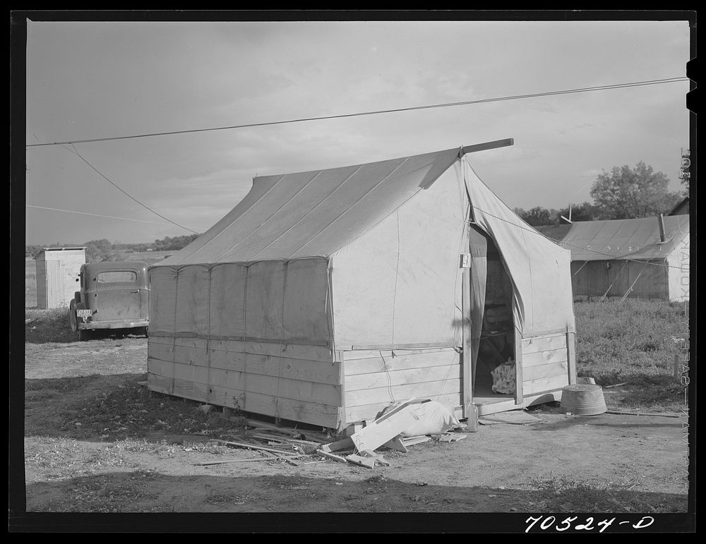 Tent of a workman and his family. Umatilla ordnance depot, Hermiston, Oregon. Tents with a bedspring in them rent for two…