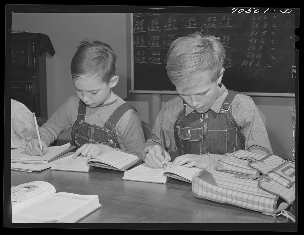 Children of workmen at the Umatilla ordnance depot have their school classes in basement of church. Hermiston, Oregon by…