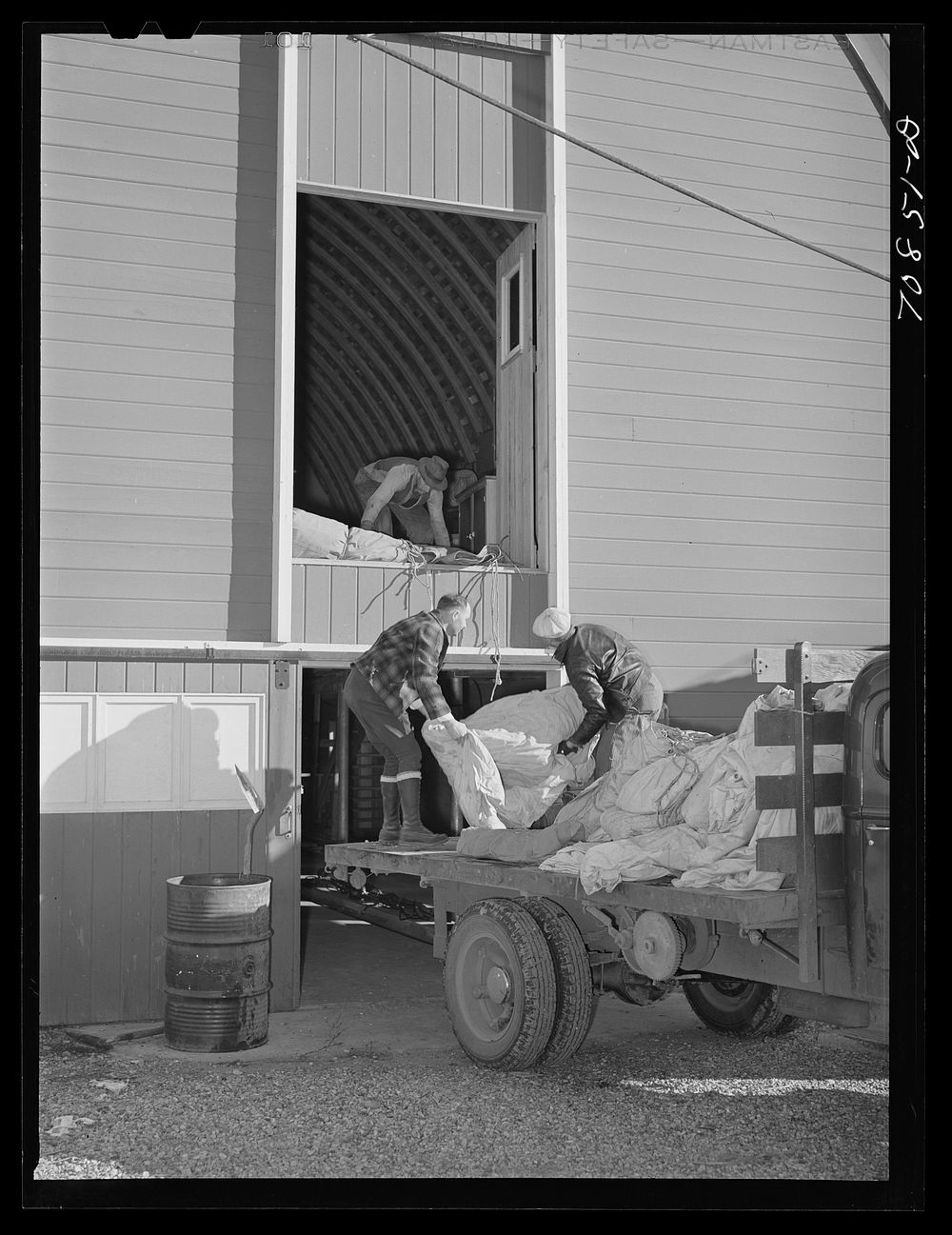[Untitled photo, possibly related to: Checking in equipment from FSA (Farm Security Administration) mobile camps as it…