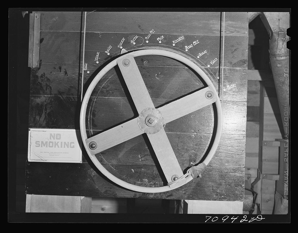 Control wheel in seed mill. Ontario, Oregon by Russell Lee