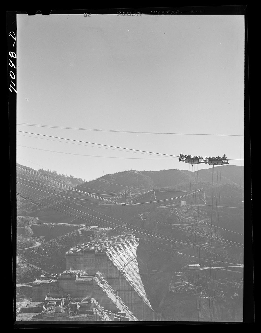 Shasta Dam under construction. The many cables are for transporting materials. Shasta County, California by Russell Lee
