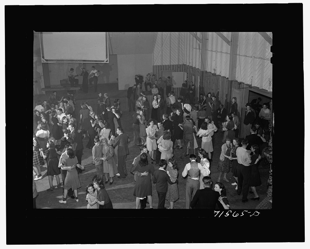 Woodville, California. FSA (Farm Security Administration) farm workers' community. Saturday night dance in the auditorium of…