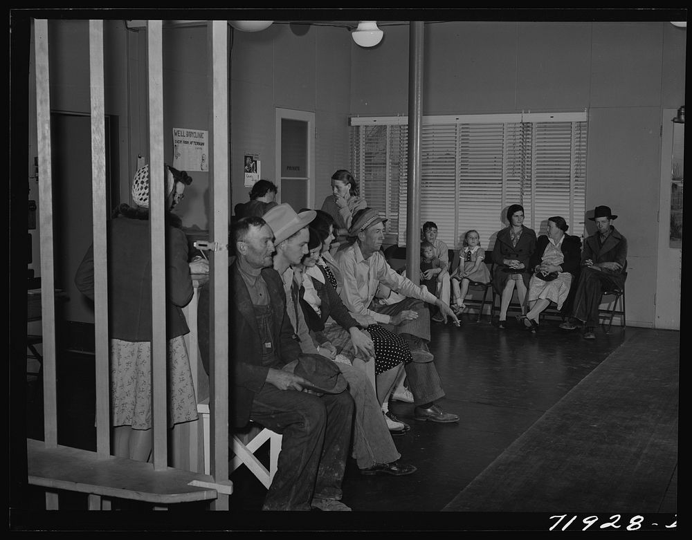 In the waiting room at the clinic at the FSA (Farm Security Administration) farm workers' community. Eleven Mile Corner…