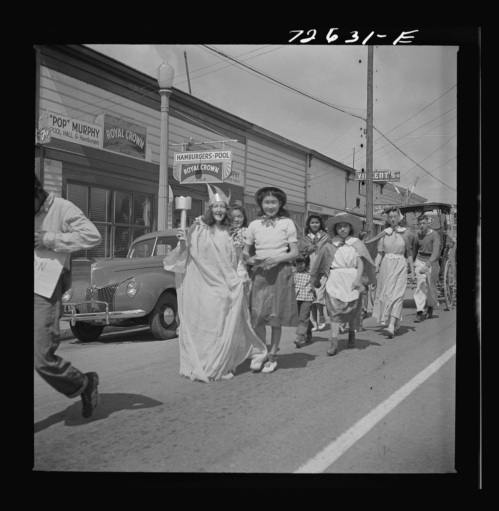 San Juan Bautista, California. Schoolchildren parading with scrap metal for the war by Russell Lee