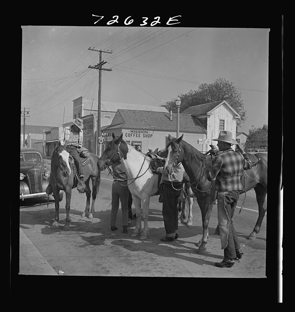 San Juan Bautista, California. Cowboys in town by Russell Lee