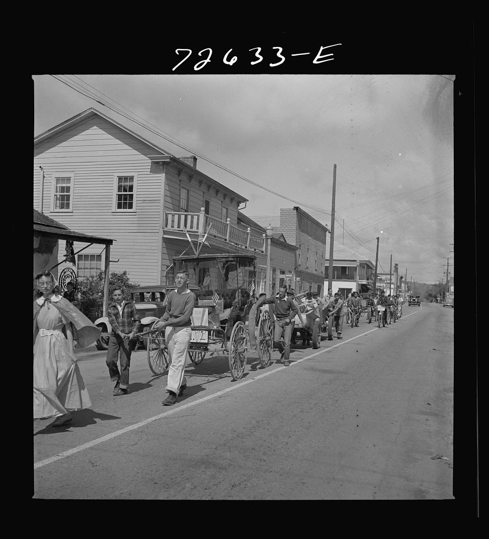 San Juan Bautista, California. Schoolchildren parading with scrap metal which they have collected for the war by Russell Lee
