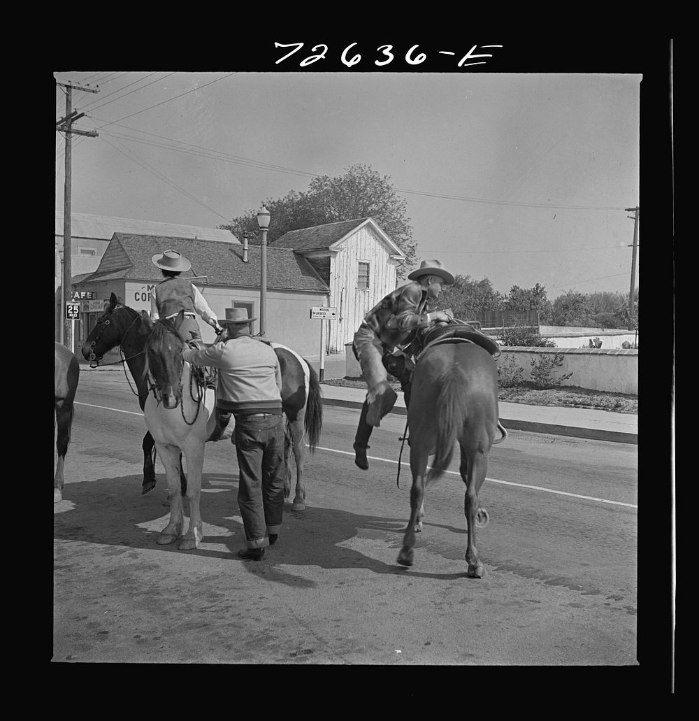 San Juan Bautista, California. Cowboys in town by Russell Lee