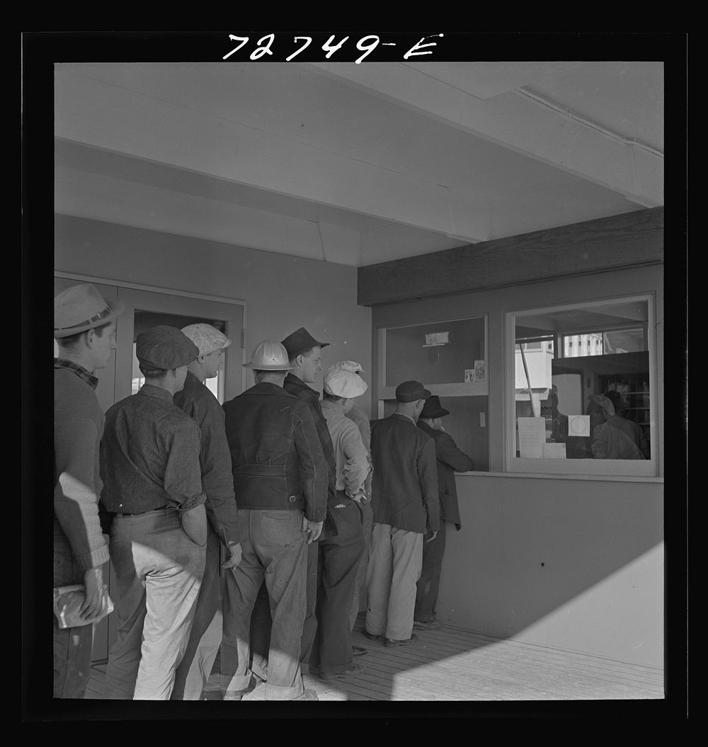 Vallejo, California. Workmen from shipyards wait for mail at the FSA (Farm Security Administration) dormitories by Russell…